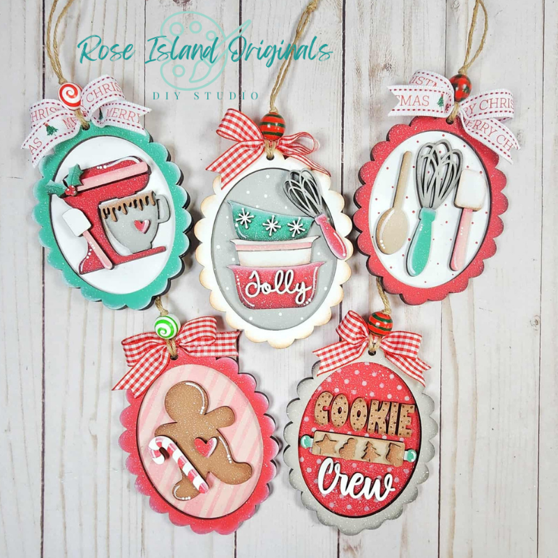 Set of Christmas-themed decorative ornaments with kitchen-themed designs on a wooden background.
