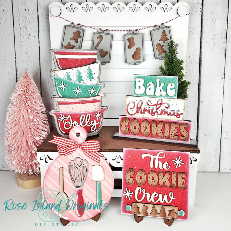 Decorative Christmas signs with baking-themed designs and 'Rose Island Original' branding.