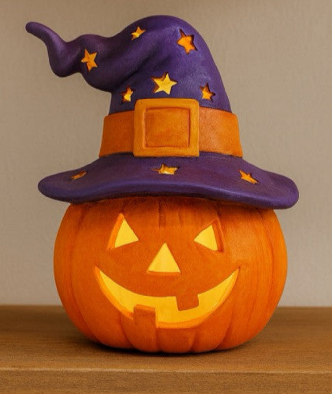 ceramic pumpkin with jack o lantern face and witch hat
