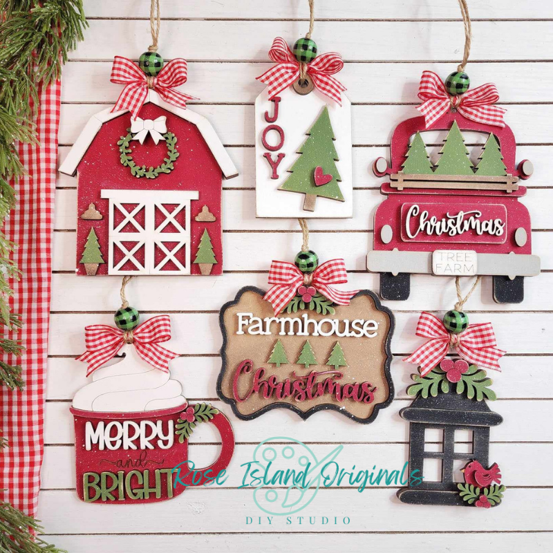 Set of Christmas-themed wooden ornaments on a wooden background with 'Rose Island Originals' branding.