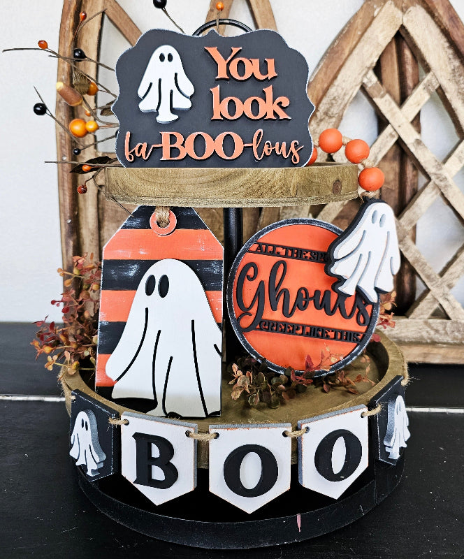 Halloween-themed decorative stand with ghost and 'You look la-BOO-lous' sign.