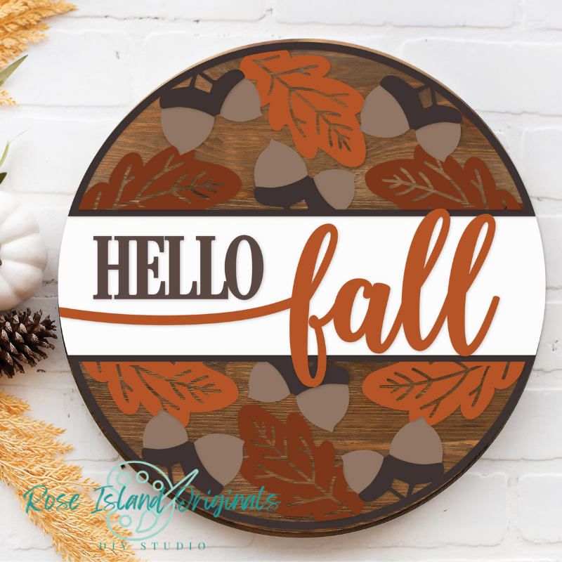 Decorative sign with 'Hello Fall' text and autumnal design on a white background