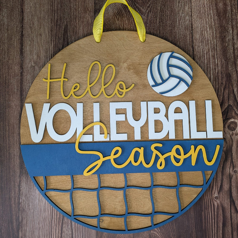 Decorative sign with 'Hello Volleyball Season' text and volleyball design on a wooden background