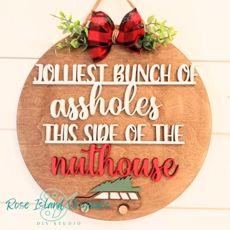 Wooden sign with humorous text and plaid bow on a white background