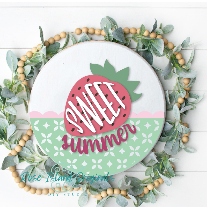 Round wood sign with a strawberry and words sweet summer.