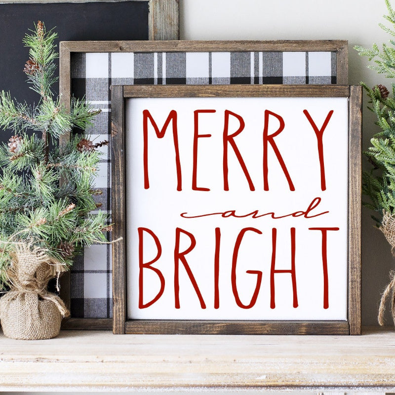 Decorative shelf with 'Merry and Bright' sign, small Christmas tree, and 'Coffee' container.