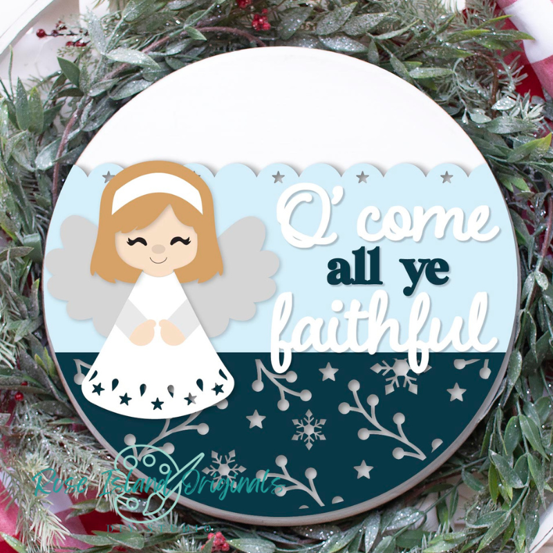 Decorative angel ornament with 'O' come all ye faithful' text on a Christmas wreath.