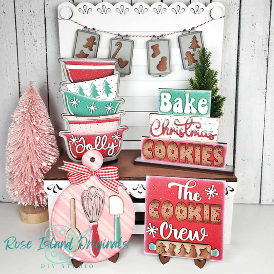 Decorative Christmas signs with baking-themed designs and 'Rose Island Original' branding.