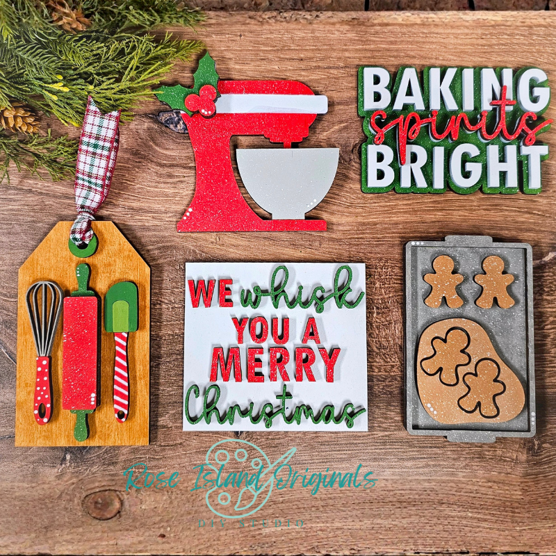 Set of Christmas-themed kitchen decor items on a wooden surface with 'Baking Spirits Bright' and 'We wish you a Merry Christmas' text.