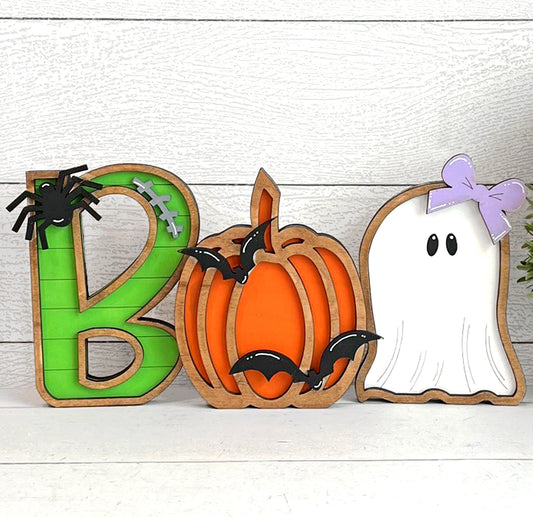 Halloween themed decor with ghosts pumpkin bats and spider