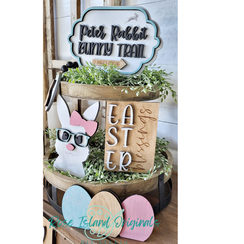 Decorative Easter display with a wooden basket, bunny, and Easter eggs.