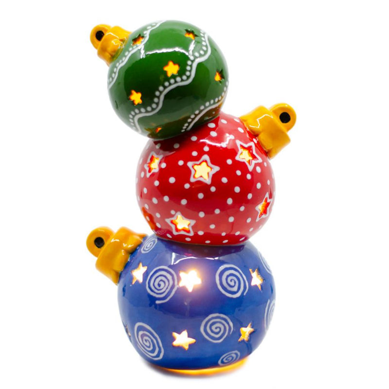 Three ceramic ornaments stacked on each other.