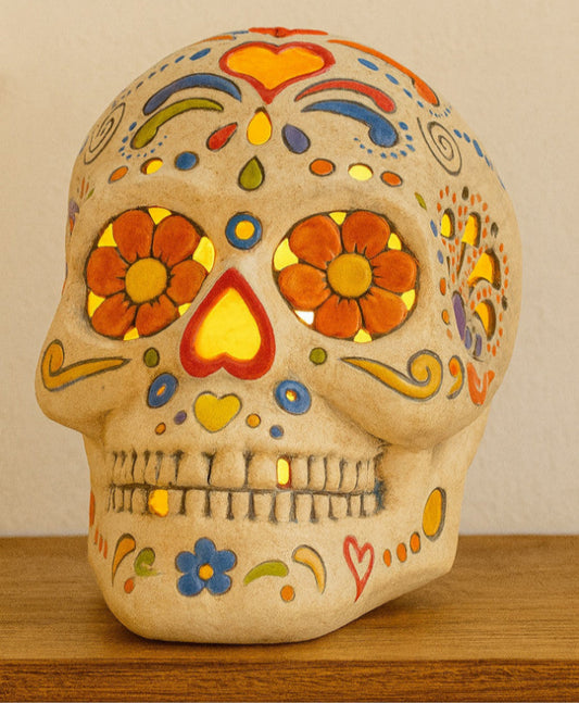 Ceramic skull with vibrant decorations, light up