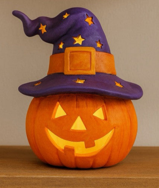 ceramic pumpkin with jack o lantern face and witch hat
