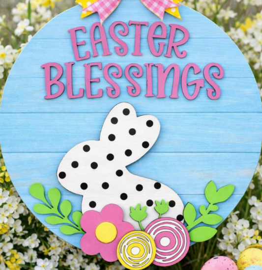 Decorative sign with 'Easter Blessings' text, bunny design, and flowers on a blue background.