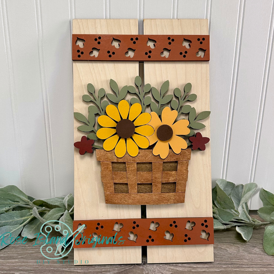 Wooden wall art with sunflower design and 'Rose Island Originals' branding.