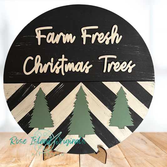 Round wooden sign with 'Farm Fresh Christmas Trees' text and tree cutouts on a white background.