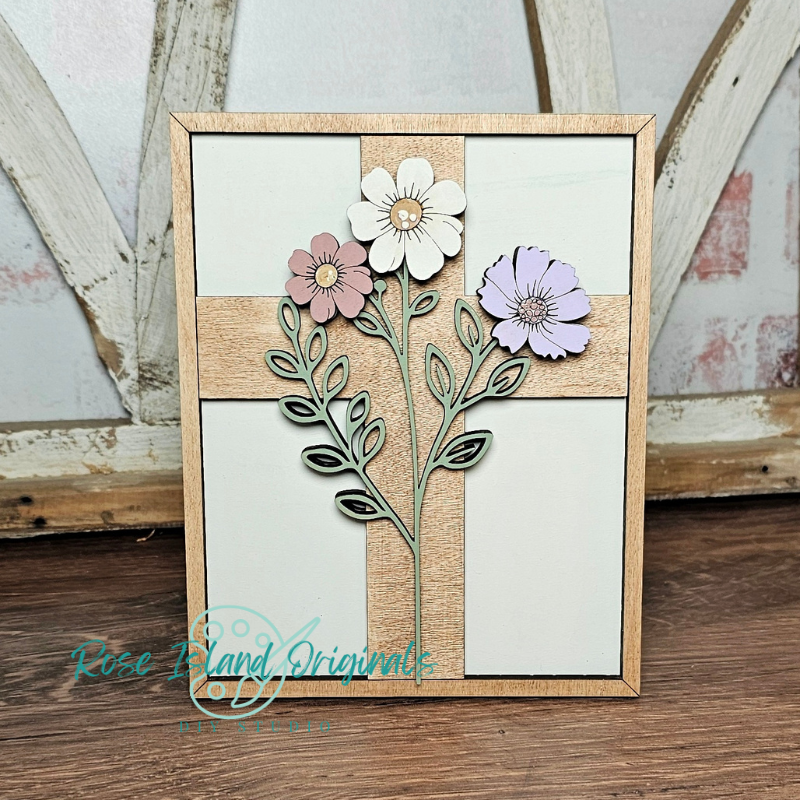 Decorative wall art with cut-out flowers and leaves on a wooden frame, featuring the brand 'Rose & Bean Originals'.