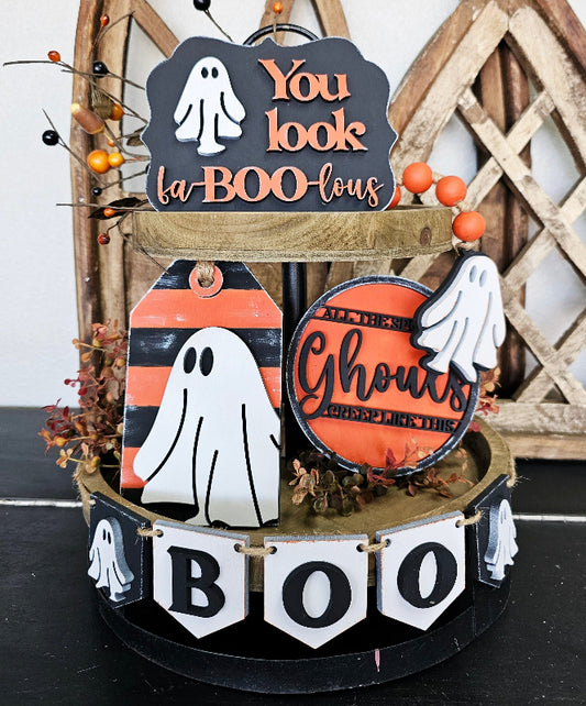 Halloween-themed decorative stand with ghost and 'You look la-BOO-lous' sign.