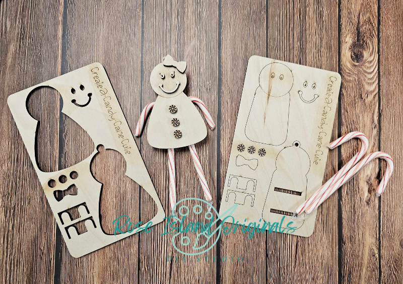 Wooden cutouts of a girl and a dog with a ruler on a wooden surface, featuring 'Olee Looe Originals' branding.