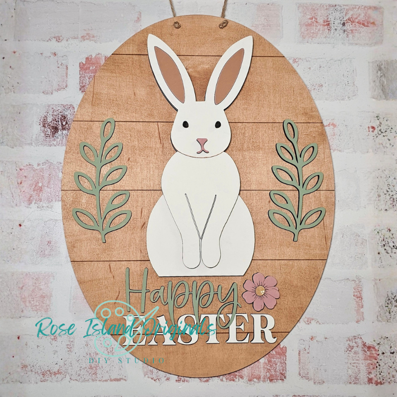 Wooden Easter sign with a white rabbit and 'Happy Easter' text on a textured background.