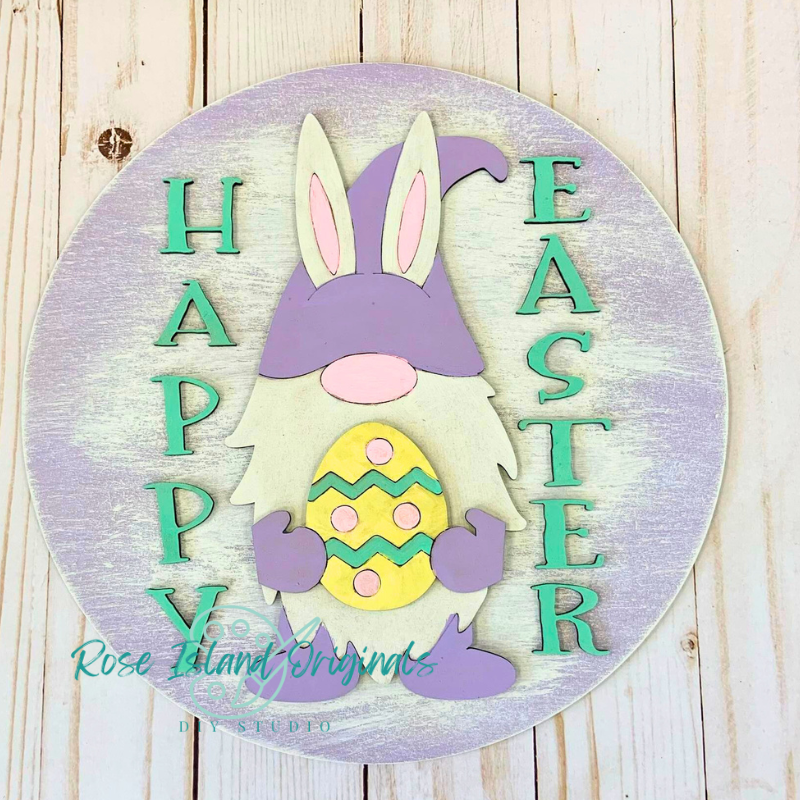 Decorative sign with an Easter gnome and egg, featuring 'Happy Easter' text on a wooden background.