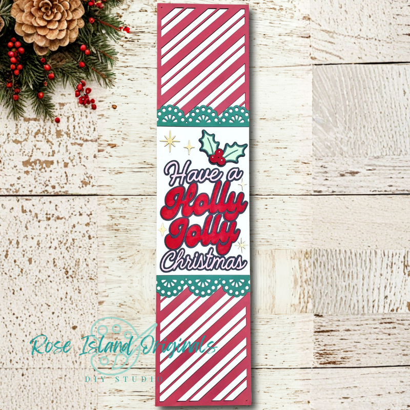 Christmas-themed decorative wood sign with text and patterns on a wooden surface.