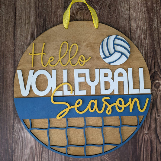 Decorative sign with 'Hello Volleyball Season' text and volleyball design on a wooden background