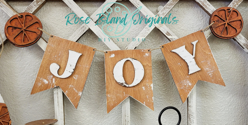 Wood banner with word Joy and orange slices