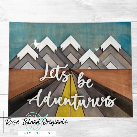 Decorative sign with mountains and a path labeled 'Let's be Adventurers' by Rose Island Originals.