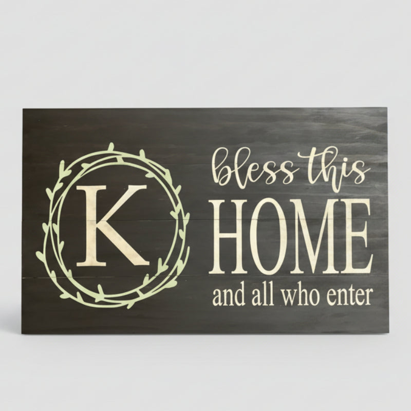 Wood sign with letter K and words bless this home and all who enter