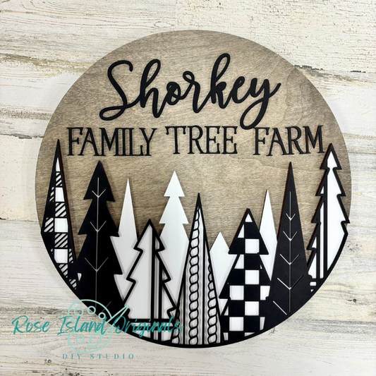 Circular sign with 'Shorkey Family Tree Farm' text and forest design on a wooden background.