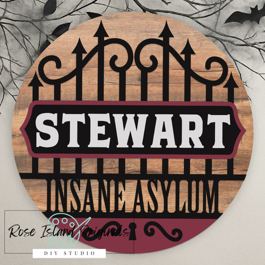 Wooden sign personalized with 'last name Insane Asylum' design on a decorative background