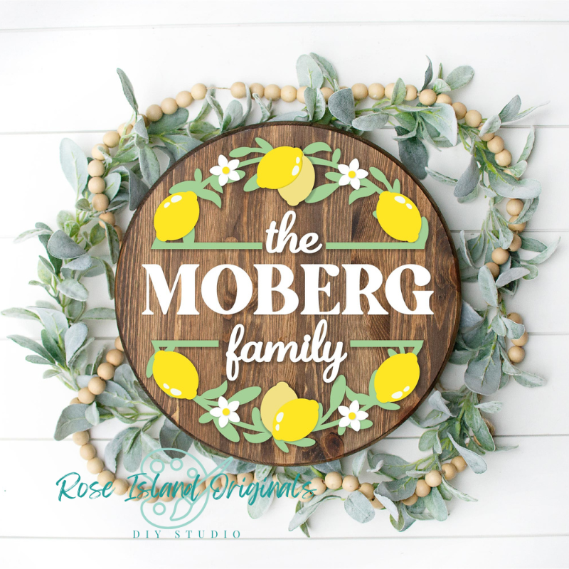 wood door hanger with lemons and the Moberg family in white text