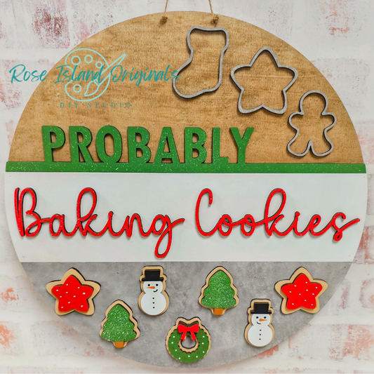 Wood round door hanger with sugar cookie motifs and words "probably baking cookies"