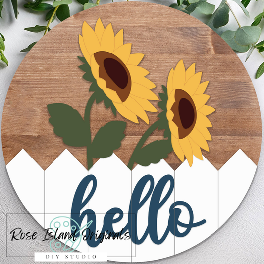 Round wooden sign with sunflowers and the word 'hello' on a white background.