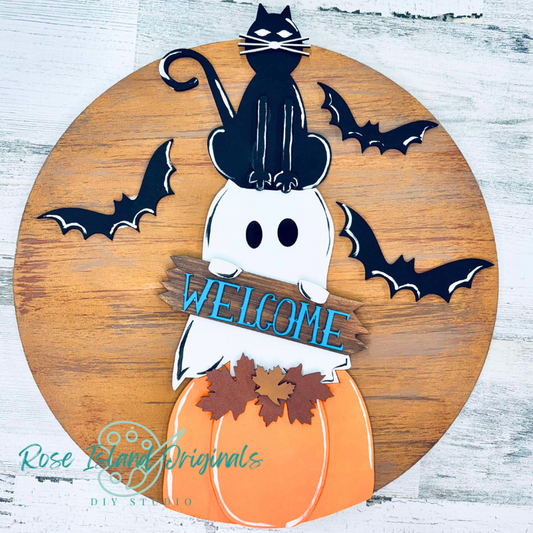 Halloween-themed wooden sign with a ghost, cat, bats, and pumpkin on a white background.