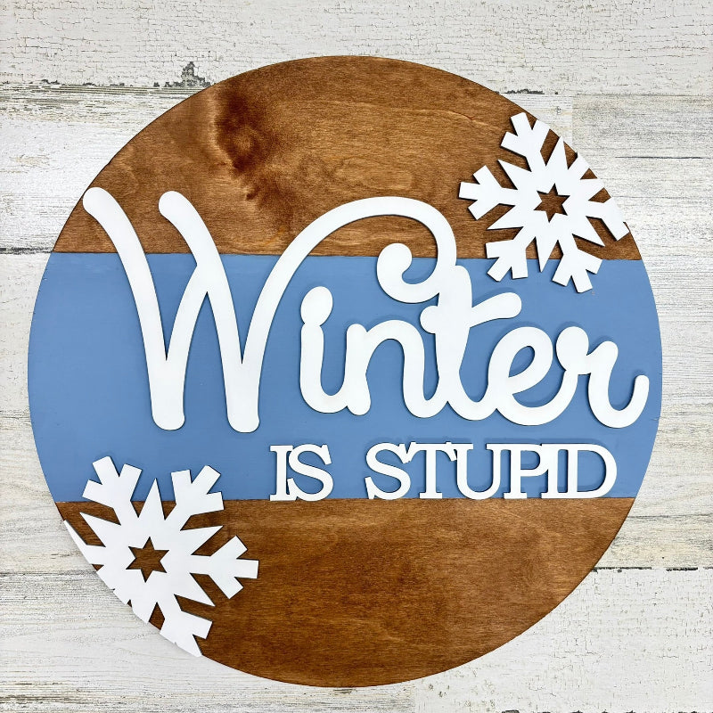 Wood round sign with Winter is Stupid
