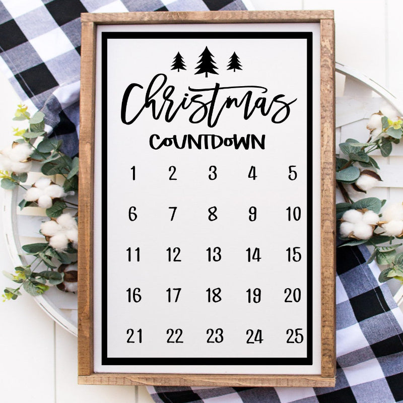 Christmas countdown calendar with decorative elements on a checkered fabric background