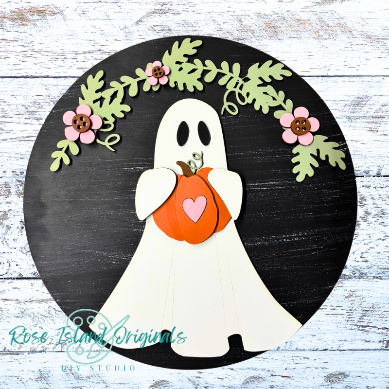 Decorative ghost holding a pumpkin with floral elements on a black circle, brand 'Rose Island Originals' visible.