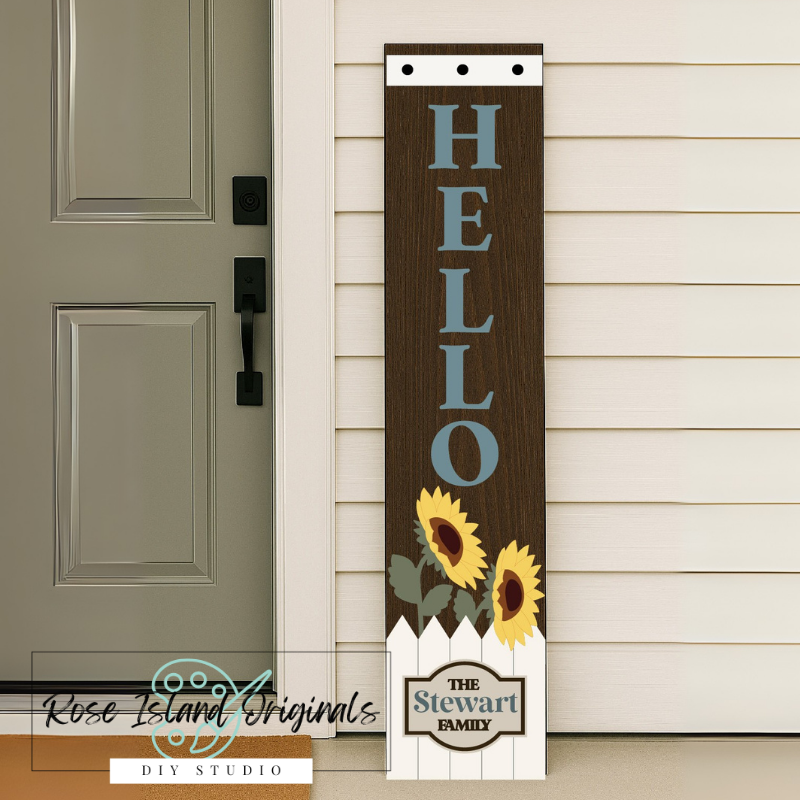 Decorative wooden sign with 'HELLO' and sunflower design on a house exterior.