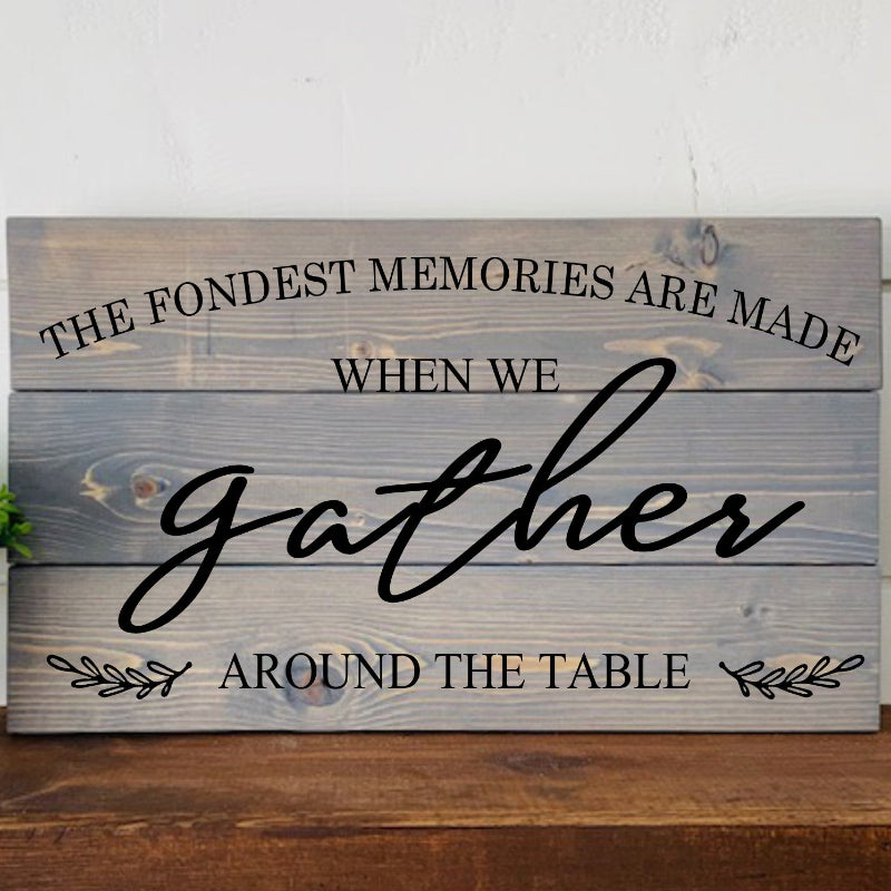 Wooden sign with engraved text on a wooden surface
