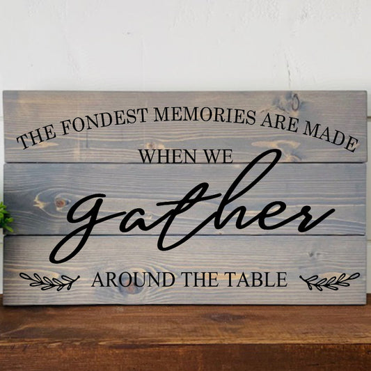 Wooden sign with engraved text on a wooden surface