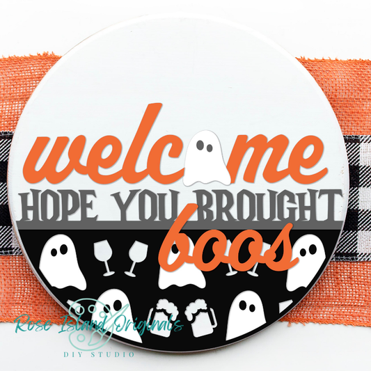 Round sign with words welcome hope you brought boos with ghosts wine glasses and beer mugs on a white background